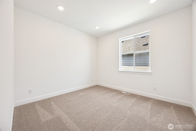 unfurnished room with baseboards, carpet flooring, recessed lighting, and visible vents
