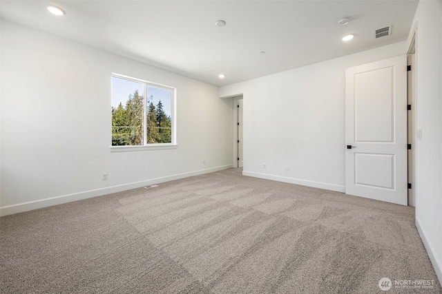 spare room featuring baseboards, carpet, and recessed lighting
