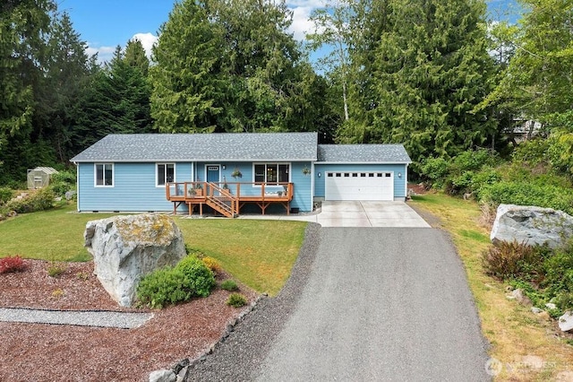 155 Baldwin Ln, Port Ludlow, WA 98365 - ranch-style home with an attached garage, driveway, roof with shingles, a front yard, and a wooden deck