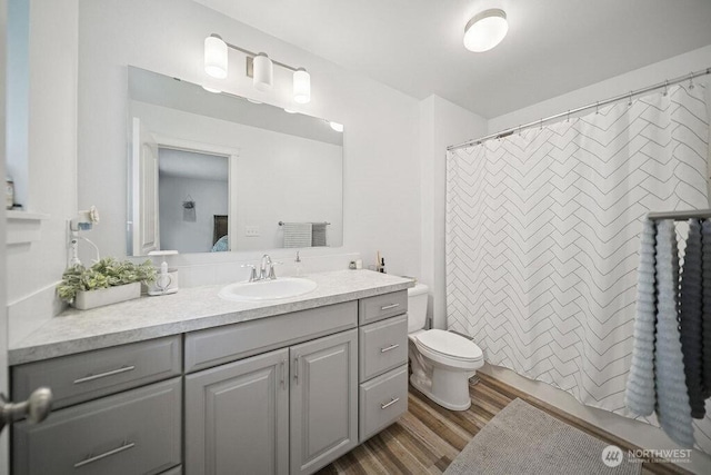 155 Baldwin Ln, Port Ludlow, WA 98365 - full bath with vanity, toilet, wood finished floors, and a shower with curtain