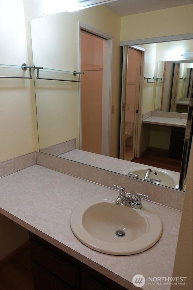 bathroom featuring toilet and vanity