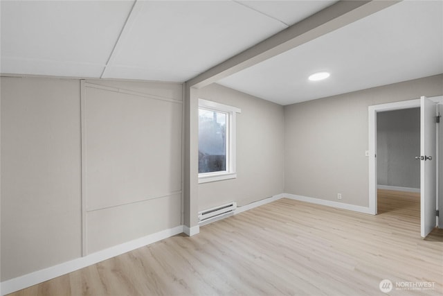 504 107th St S, Tacoma, WA 98444 - basement with baseboards, light wood finished floors, and baseboard heating