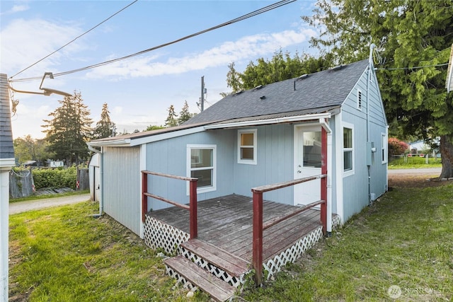 504 107th St S, Tacoma, WA 98444 - rear view of property with a yard, a deck, and a shingled roof