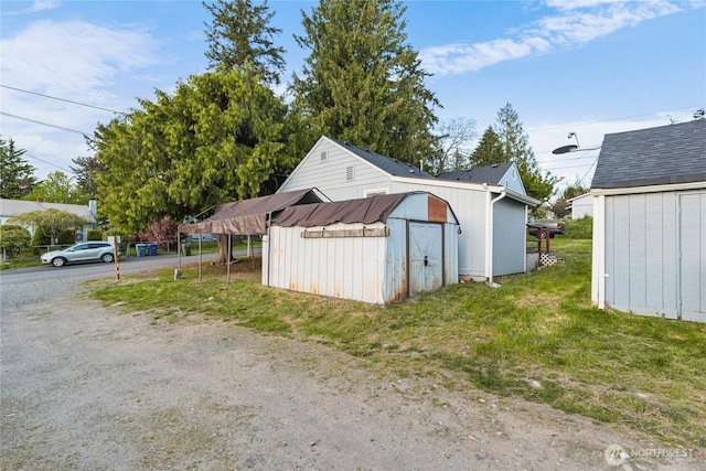 504 107th St S, Tacoma, WA 98444 - garage with a storage shed and driveway