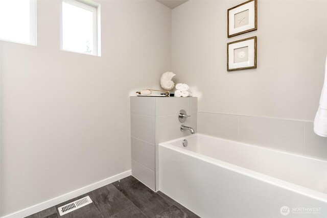 13826 Brookdale Ln E Unit 96, Tacoma, WA 98445 - full bathroom with baseboards, visible vents, and a bath