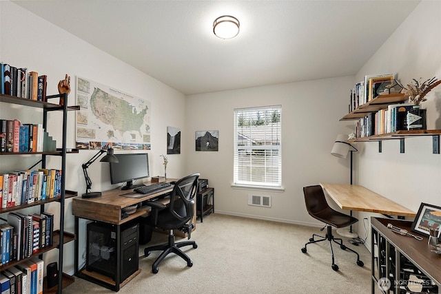office area featuring carpet flooring, baseboards, and visible vents