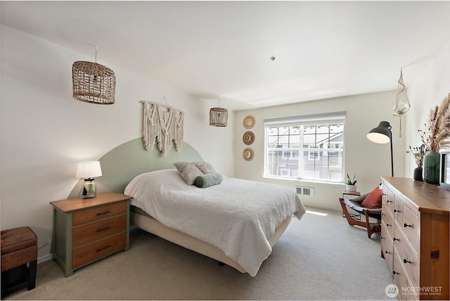 bedroom featuring light colored carpet, baseboards, and visible vents