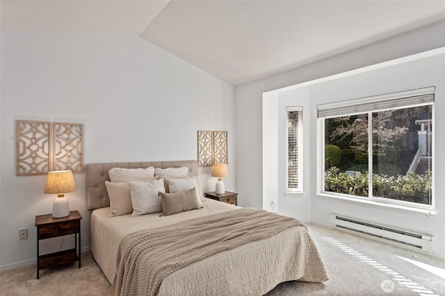 carpeted bedroom featuring a baseboard heating unit and vaulted ceiling