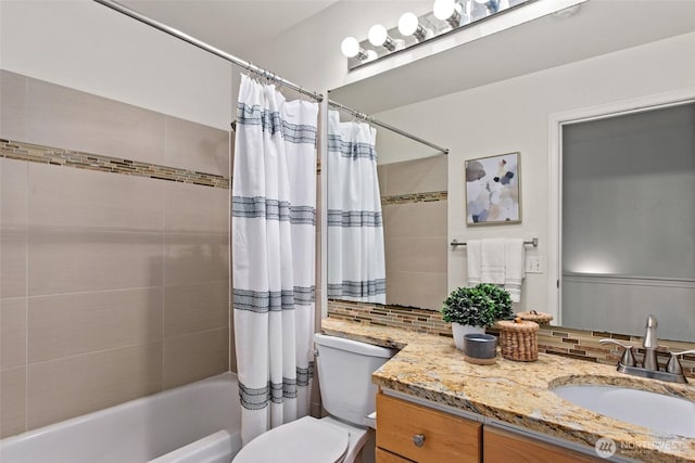 bathroom featuring vanity, shower / tub combo with curtain, toilet, and tasteful backsplash