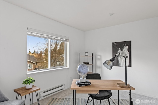carpeted office space with a baseboard radiator and a wealth of natural light