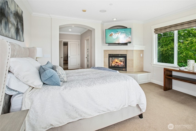 3011 Mountain View Ave N, Renton, WA 98056 - bedroom with light colored carpet, a fireplace, arched walkways, crown molding, and baseboards