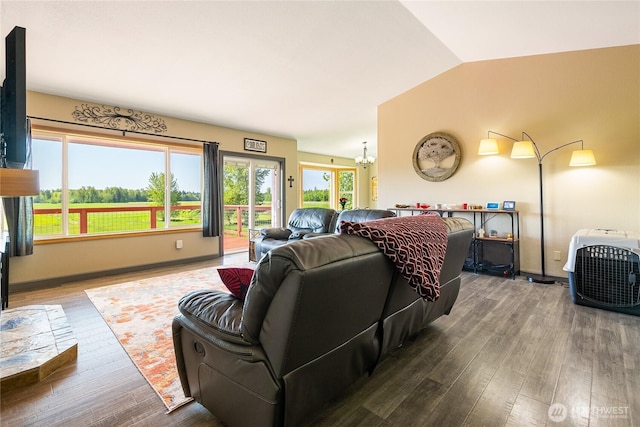 2995 Haynie Rd, Custer, WA 98240 - living room with wood finished floors, vaulted ceiling, a chandelier, and baseboards
