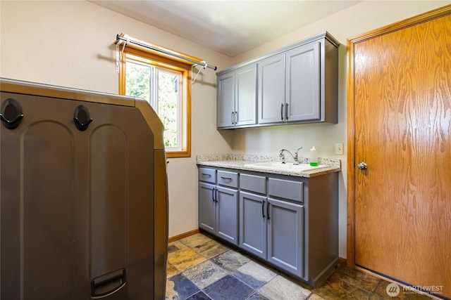 2995 Haynie Rd, Custer, WA 98240 - laundry room featuring stone tile floors and baseboards