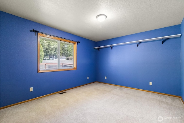 2995 Haynie Rd, Custer, WA 98240 - carpeted empty room featuring baseboards and a textured ceiling