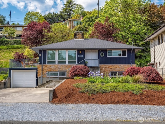 16631 Sylvester Rd SW, Burien, WA 98166 - ranch-style home featuring roof with shingles, driveway, a chimney, and stone siding