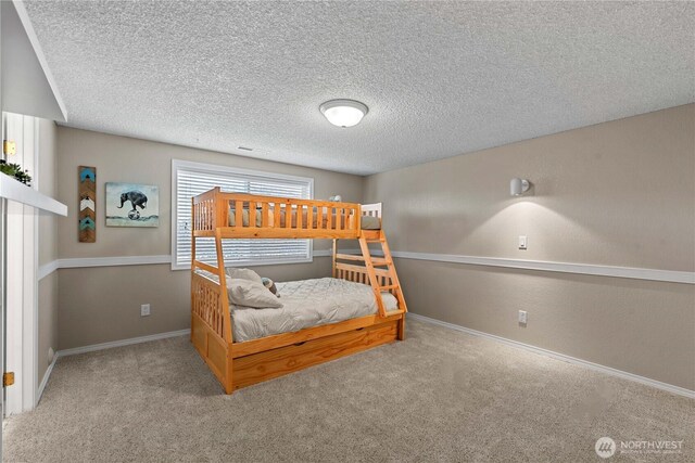 1014 Westmorland Dr, Wenatchee, WA 98801 - bedroom featuring carpet flooring, a textured ceiling, and baseboards