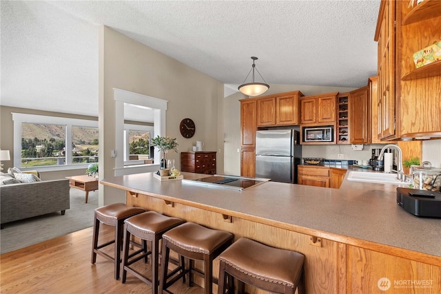 1014 Westmorland Dr, Wenatchee, WA 98801 - kitchen featuring a sink, built in microwave, freestanding refrigerator, open shelves, and black electric cooktop