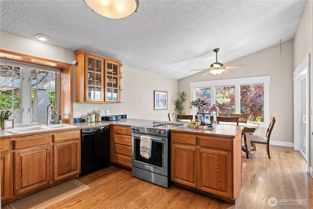 1014 Westmorland Dr, Wenatchee, WA 98801 - kitchen featuring dishwasher, electric range, a sink, a peninsula, and light wood finished floors