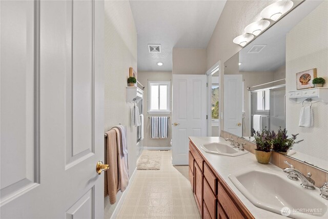 1014 Westmorland Dr, Wenatchee, WA 98801 - bathroom with a shower with door, double vanity, and a bath