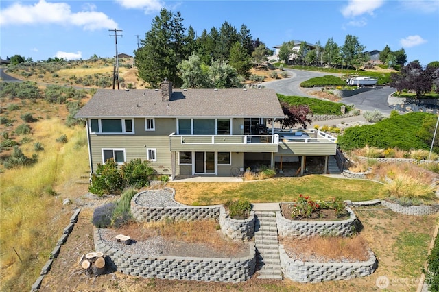 1014 Westmorland Dr, Wenatchee, WA 98801 - back of house with stairs, a deck, a lawn, and a chimney