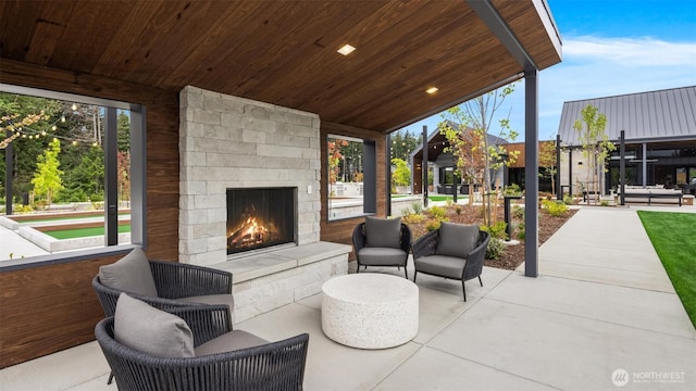 33107SITE142 Liberty Ave SE, Black Diamond, WA 98010 - view of patio / terrace with an outdoor living space with a fireplace