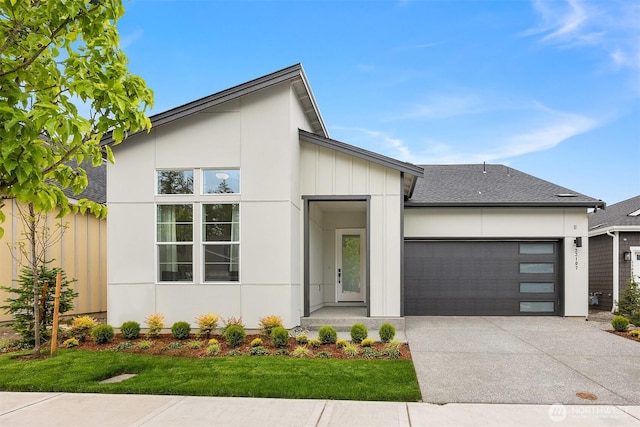 33107SITE142 Liberty Ave SE, Black Diamond, WA 98010 - contemporary home featuring a garage, concrete driveway, and a front yard