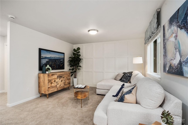 living room with carpet flooring and baseboards