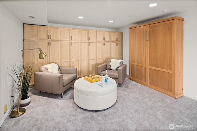 living area with carpet flooring, recessed lighting, and baseboards
