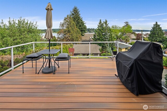 wooden terrace with area for grilling