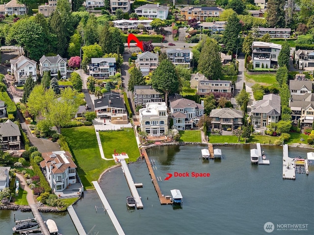 aerial perspective of suburban area featuring a large body of water