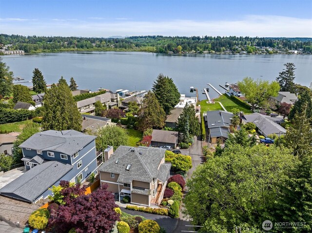 aerial view of residential area featuring a nearby body of water