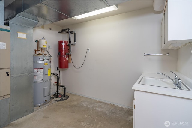 utilities featuring a sink and strapped water heater