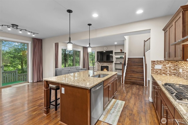 3530 128th St SE, Everett, WA 98208 - kitchen with a sink, a stone fireplace, open floor plan, stainless steel appliances, and dark wood finished floors