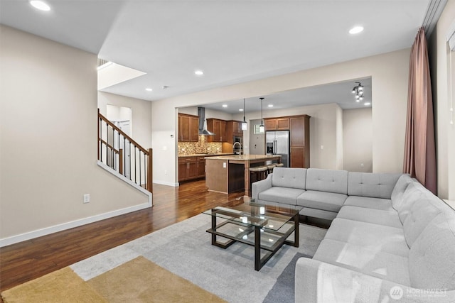 3530 128th St SE, Everett, WA 98208 - living room with dark wood-style flooring, baseboards, recessed lighting, and stairway