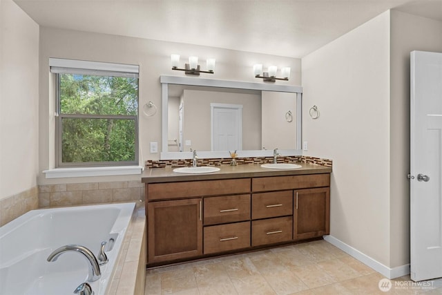 3530 128th St SE, Everett, WA 98208 - bathroom featuring a bath, double vanity, baseboards, and tile patterned flooring