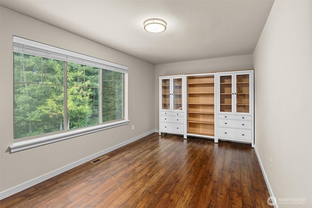 3530 128th St SE, Everett, WA 98208 - unfurnished bedroom featuring baseboards and dark wood-style flooring