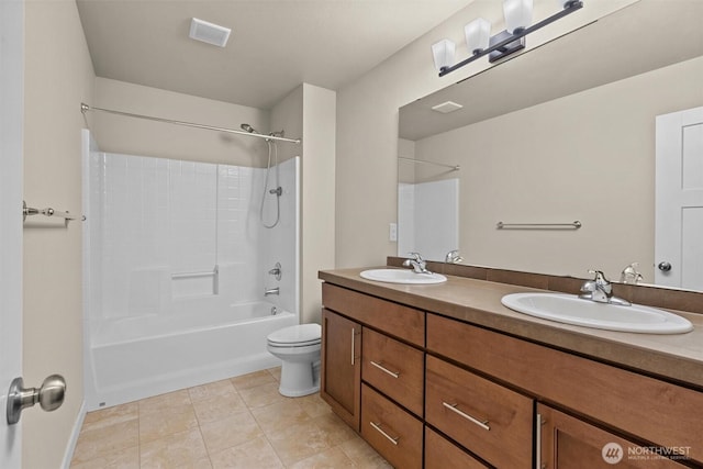 3530 128th St SE, Everett, WA 98208 - bathroom featuring toilet, double vanity, tile patterned floors, and shower / tub combination