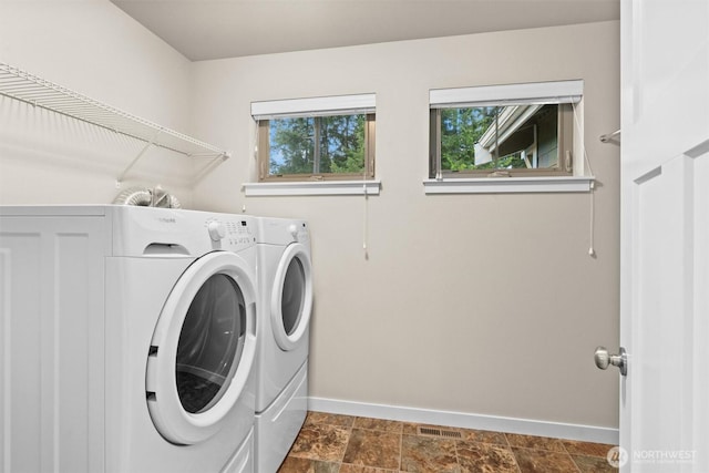 3530 128th St SE, Everett, WA 98208 - laundry area featuring washer and clothes dryer, baseboards, and healthy amount of natural light