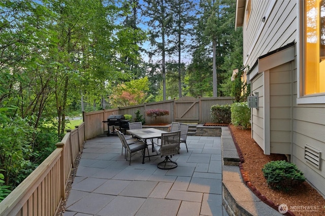 3530 128th St SE, Everett, WA 98208 - fenced backyard with outdoor dining space, a patio area, a gate, and a grill