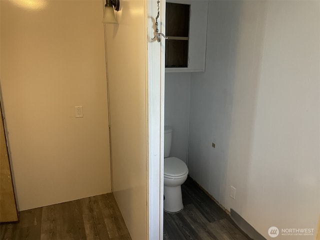bathroom featuring toilet and wood finished floors