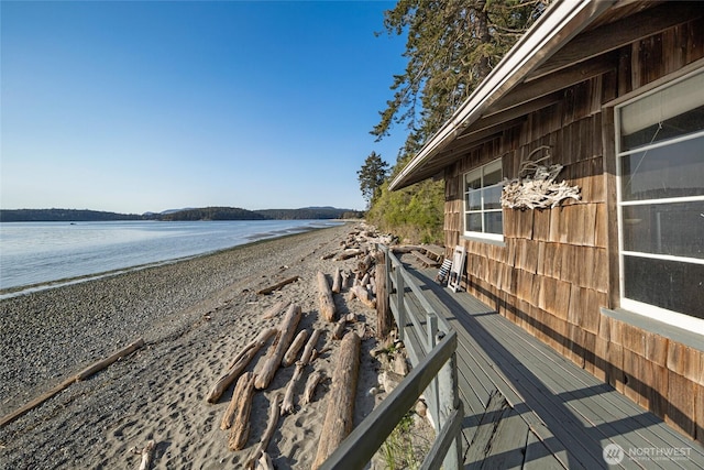 wooden terrace with a water view