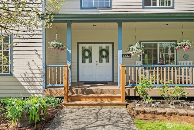 entrance to property featuring covered porch