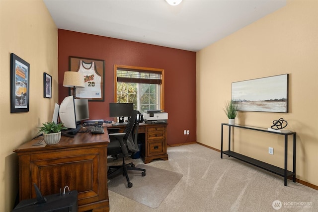 home office featuring light carpet and baseboards