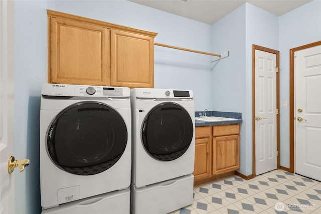 washroom with cabinet space and independent washer and dryer