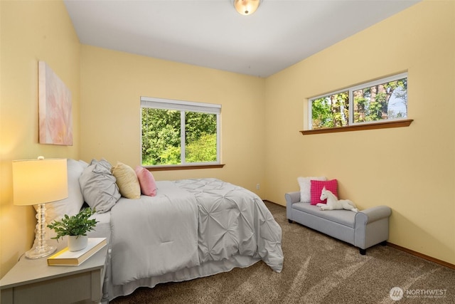 carpeted bedroom with baseboards