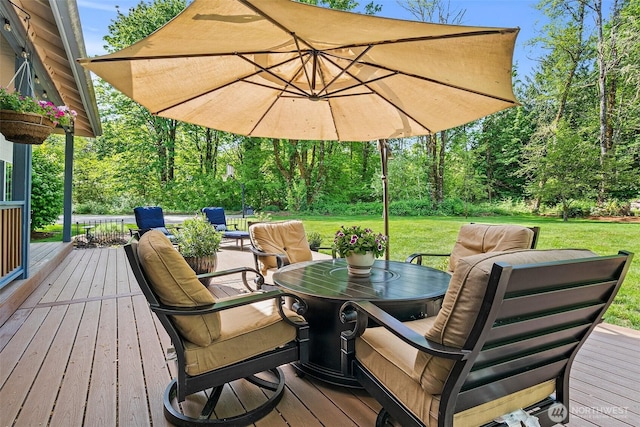 deck with a yard, outdoor dining area, and an outdoor living space