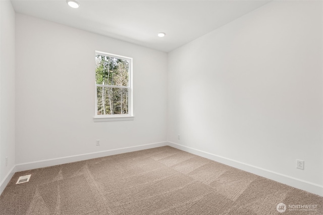 unfurnished room featuring visible vents, recessed lighting, baseboards, and carpet floors