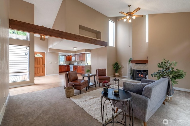 25432 213th Pl SE Unit 4, Maple Valley, WA 98038 - living room with a high ceiling, light colored carpet, baseboards, and healthy amount of natural light