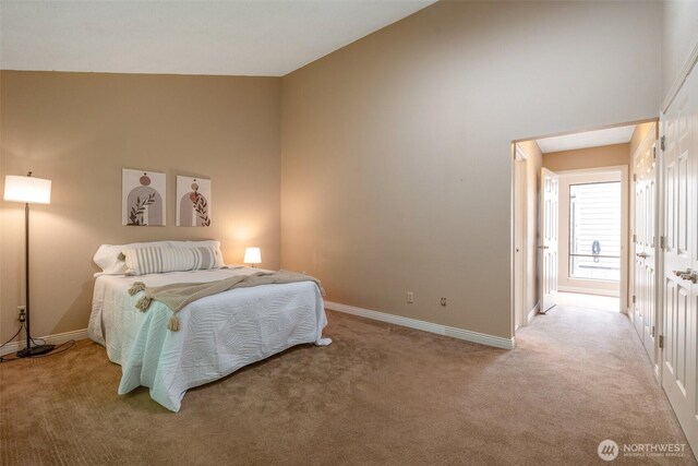 25432 213th Pl SE Unit 4, Maple Valley, WA 98038 - bedroom featuring baseboards, light colored carpet, and high vaulted ceiling