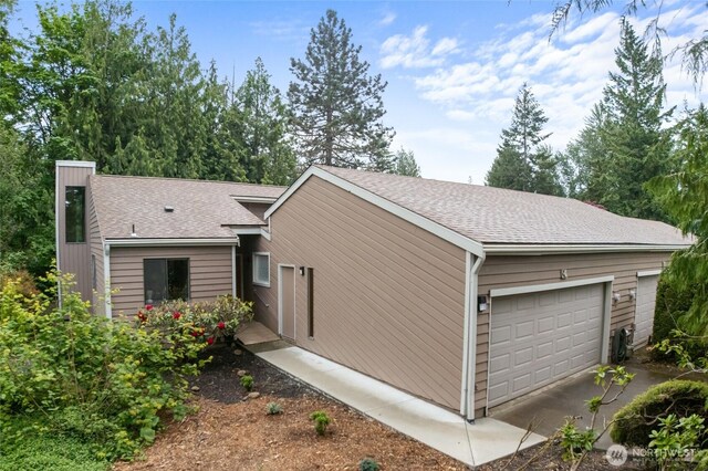 25432 213th Pl SE Unit 4, Maple Valley, WA 98038 - view of side of property with roof with shingles and a garage